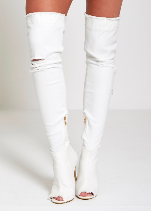 ripped jeans thigh high boots